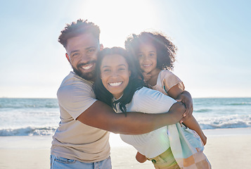 Image showing Beach, vacation and portrait of a happy family with a child excited for a sea or ocean holiday together in happiness. Water, father and young mother playing piggyback with a kid on a summer trip