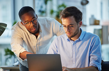 Image showing Laptop, black man or manager training a worker with advice or research project in digital agency. Night, leadership or boss helping, coaching or speaking of SEO data or online business to employee