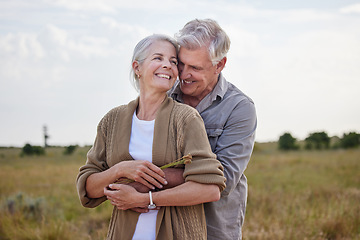 Image showing Love, hug and smile with old couple in nature for bonding, happy and romance. Happiness, retirement and support with senior man and woman in countryside for affectionate, holiday and vacation