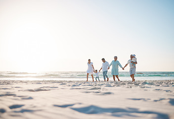 Image showing Big family, holding hands and holiday on beach with mockup space for weekend or vacation. Grandparents, parents and kids walking together on the ocean coast for fun bonding or quality time in nature