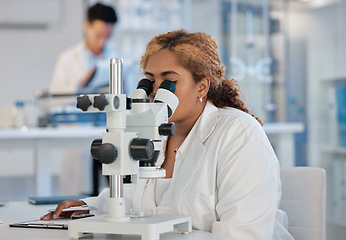 Image showing Science, research and microscope with a woman at work in a laboratory for innovation or investigation. Healthcare, medical and experiment with a female scientist working in a lab for pharmaceuticals