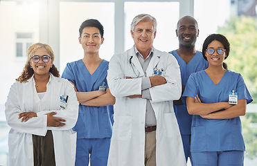 Image showing Happy portrait, arms crossed and group of doctors standing together in hospital. Face, teamwork and confident medical professionals, nurses and surgeons with collaboration, healthcare and support.