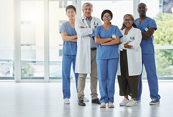 Image showing Portrait, doctors and team of nurses with arms crossed standing together in hospital. Face, confident and medical professionals, surgeons or group with healthcare collaboration, teamwork and happy.