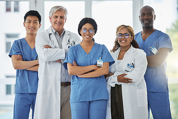 Image showing Nurses, portrait and team of doctors with arms crossed standing together in hospital. Face, confident and medical professionals, surgeons or group with healthcare collaboration, teamwork and happy.