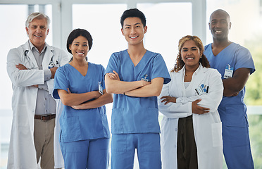 Image showing Nurses, portrait and team of doctors with arms crossed standing together in hospital. Face, confident and medical professionals, group and happy surgeons in collaboration, teamwork and healthcare.