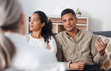 Image showing Angry couple on sofa, therapy and marriage counselling, advice and problem solving in relationship. Stress, man and woman with therapist in conversation, work on healthy communication and healing.