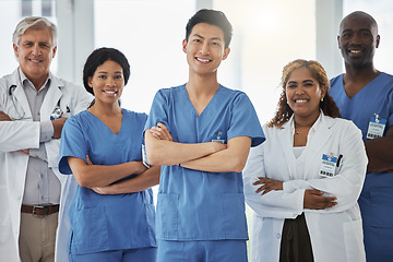 Image showing Portrait, nurses and group of doctors with arms crossed standing together in hospital. Face, confident and medical professionals, team and happy surgeons in collaboration, teamwork and healthcare.