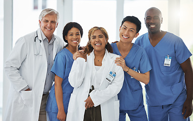 Image showing Portrait, nurses and team of doctors smile standing together in hospital or clinic. Face, healthcare and medical professionals, group diversity or happy surgeons in collaboration, teamwork or support