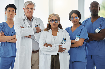 Image showing Leadership portrait, serious and doctors with arms crossed standing together in hospital. Face, teamwork and confident medical professionals, surgeon group or nurses with collaboration for healthcare