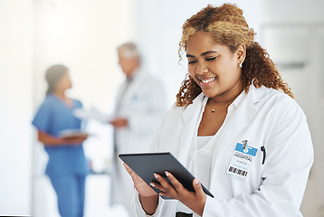 Image showing Smile, woman and doctor with tablet for research, telehealth or healthcare in hospital. Technology, medical professional and African female surgeon with email, wellness app and online consultation.