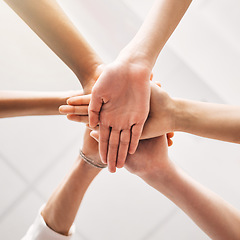 Image showing Hands stacked, teamwork and group of people in support, collaboration goals and community or solidarity from below. Circle, women and team work, faith or together sign isolated on a white background