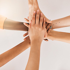 Image showing Hands stacked, teamwork and women in support, collaboration goals and community or solidarity from above. Circle, group of people and team work, faith or together sign isolated on a white background