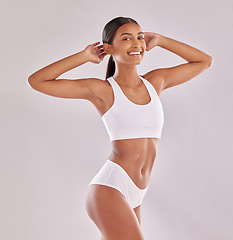 Image showing Woman in underwear, smile in portrait with body and fitness, health and skin isolated on studio background. Happy female model, abdomen and healthy lifestyle with wellness and person lose weight