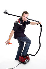 Image showing Man with vacuum cleaner