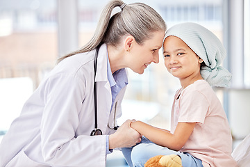 Image showing Smile, pediatrician and child holding hands on bed in hospital for children, health and support in cancer treatment. Pediatrics, healthcare and happy kid, doctor with young patient for health care.