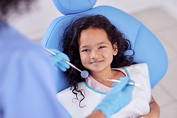 Image showing Dentistry, portrait and girl child at the dentist for teeth cleaning, oral checkup or consultation. Healthcare, smile and kid laying on the chair for dental mouth examination with equipment in clinic