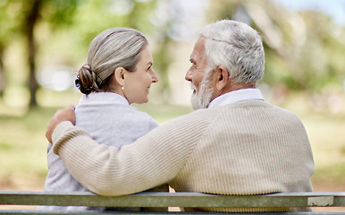 Image showing Back, senior couple and hug in park with love and view of nature, retirement together and peace. Elderly man, woman and marriage with commitment, relationship and pension with trust and care outdoor