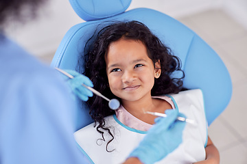 Image showing Dentistry, happy and kid patient at dentist for teeth cleaning, oral checkup or consultation. Healthcare, smile and girl child laying on chair for dental mouth examination with equipment in a clinic.