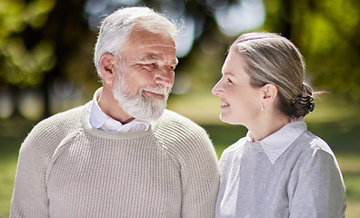 Image showing Old couple in park with love and retirement together, trust and support with care and people in nature. Elderly man, woman and marriage with commitment, relationship and pension with smile outdoor