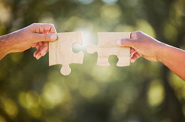 Image showing Hands, puzzle piece and outdoor with sustainability, eco friendly and agriculture development. Growth, collaboration and farm planning with farmer hand and bokeh in nature to connect with synergy