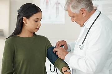 Image showing Medical, blood pressure and mature doctor with a patient for a consultation in the hospital. Medicine, equipment and healthcare worker checking hypertension of a woman at a checkup in medicare clinic