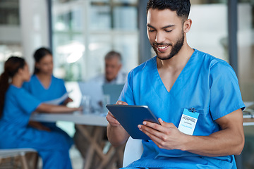 Image showing Hospital, doctor and man on tablet for medical analysis, research and report in team meeting. Healthcare, clinic and happy male nurse on digital tech for wellness app, online consulting and service