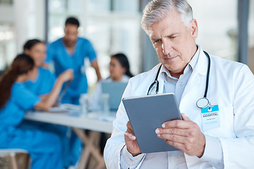 Image showing Meeting, doctor and senior man with tablet for medical analysis, research and report in hospital. Healthcare, clinic and male worker on digital tech for wellness app, online consulting and service