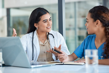 Image showing Hospital, doctors and women in discussion on laptop for medical analysis, research and internet. Healthcare, clinic and female health workers talking on computer for diagnosis, consulting and service