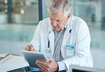 Image showing Hospital, doctor and senior man on tablet for medical analysis, research and report. Healthcare, clinic and elderly male health worker on digital tech for wellness app, online consulting and service