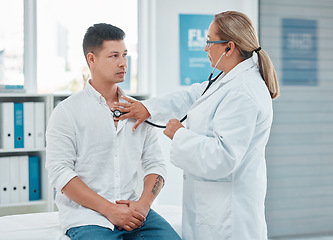 Image showing Healthcare, doctor test with man patient and consultation with stethoscope at a hospital room. Cardiology or health wellness, medicine and surgeon medical exam with a male person in a clinic building