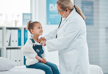 Image showing Health wellness, doctor exam with child patient and consultation with stethoscope at a clinic. Cardiology or healthcare, medicine and surgeon medical test with a female kid in a hospital building