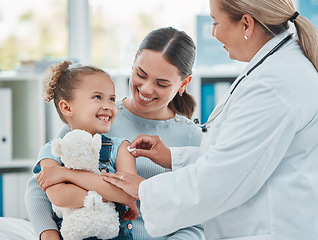 Image showing Pediatrician, girl and doctor with vaccine injection, cotton ball and flu shot on arm for disease or covid prevention in hospital. Woman, nurse and immunity of child against virus, bacteria or happy