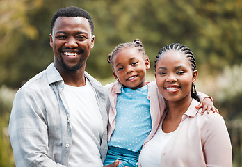Image showing Smile, portrait and black family outdoor, hug and happiness with bonding, park and loving together. Face, happy mother and father with female kid, daughter and girl embrace parents, backyard and love