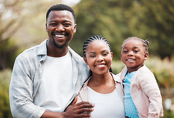 Image showing Happy, portrait and black family outdoor, hug and bonding in a park, loving together and weekend break. Face, mother or father with female kid, daughter or embrace with child development and backyard