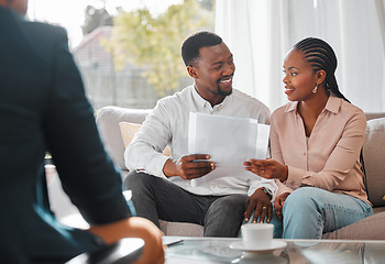 Image showing Contract, married couple with financial advisor and documents in a living room of a home. Investment or investment, paperwork and planning with people in a meeting sitting on furniture together