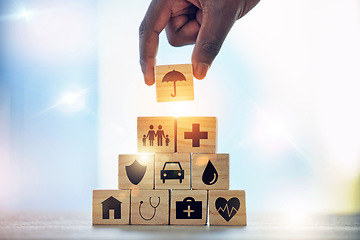 Image showing Man, hand and building blocks with medical icon for investment, security and insurance cover. Finger, choice and male with puzzle for healthcare, family or asset management, safety or future planning