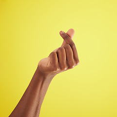 Image showing Hand, gesture for money and sign language of man closeup on studio background for cash, finance or currency. Person, thumb and index fingers rubbing together or symbol to pay, payment and poor