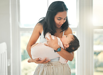 Image showing Family home, mother and holding baby with love, security and support. Woman or mom talking to girl child to relax or sleep in a house for development, wellness and growth with care on mothers day