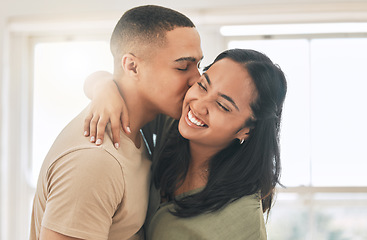 Image showing Couple, love and kiss in home for happy romance, intimacy and relax while bonding together. Young man, woman and kissing partner in relationship, quality time and smile for care, trust and happiness