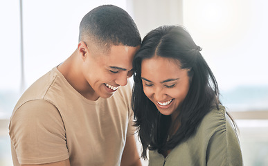 Image showing Couple, smile and laughing in home for love, intimacy and relax for romance, bonding and trust together. Young man, woman and happy partner with care, quality time or happiness in loving relationship