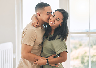 Image showing Happy couple, kiss and hug in home of love, intimacy and relax for romance, bonding and trust together. Young man, woman and kissing partner for quality time, care or happiness in loving relationship