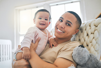 Image showing Dad, holding baby and portrait in a family home for bonding, security and quality time. Man or father and girl child relax and smile together on lounge sofa for development, trust and support or care