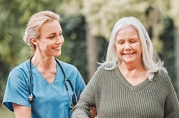 Image showing Support, smile and nurse walking elderly woman in a garden to relax, wellness and morning exercise in the lawn. Trust, nursing home and caregiver help senior person smile and happy for outdoor walk