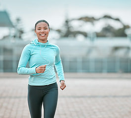 Image showing Portrait, city or black woman running, exercise or training with earphones, health or cardio. Face, female person or runner with motivation, workout goal or practice with wellness, outdoor or fitness