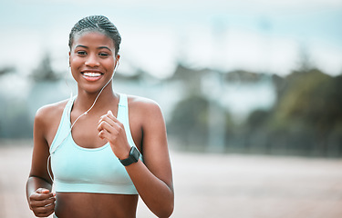 Image showing Portrait, outdoor and black woman running, fitness and workout goal for wellness, health and cardio. Face, female person and runner with earphones, motivation and exercise with training and sports