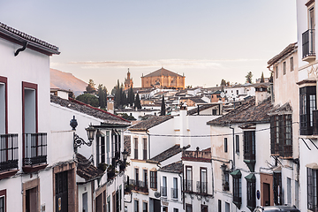 Image showing Views of the medieval village of Ronda with white Andalusian houses and the gothic style church of Santuario de Maria Auxiliadora. Malaga, Spain.