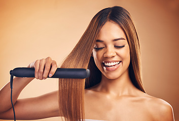 Image showing Woman, hair and beauty, flat iron and smile, haircare and keratin treatment isolated on studio background. Female model with highlights, electric straightener and heat, happy with growth and texture