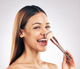 Image showing Makeup brush, portrait and excited woman in studio with a natural, cosmetic and luxury face routine. Glamour, cosmetology and female model with beauty product for cheeks isolated by white background.