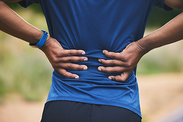 Image showing Back pain, fitness and hands of man in park after workout, exercise and training or running outdoors. Medical emergency, health and closeup of male person with muscle strain, injury or hurt in nature