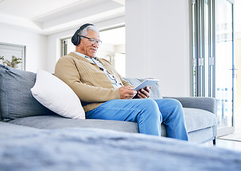 Image showing Elderly man, relax with tablet and headphones at home, retirement and technology with online streaming. Surfing internet, watching videos and wireless tech with old male person sitting on couch